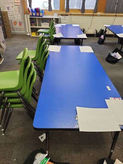 2 blue school tables and 12 green stacking chairs- items around tables not included image