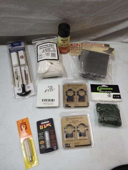 Leupold ring mounts, gun sock, gun cleaning cotton, cleaning patches, dry lube.Ammo wallets image