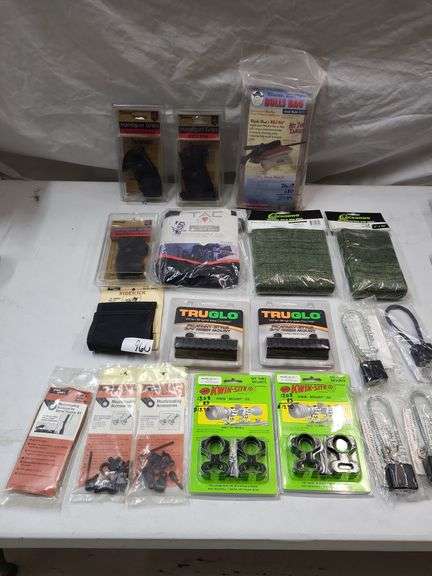 Gun accessory lot, gunsocks, scope quick mounts, gun locks and gun grips, bull's bag image