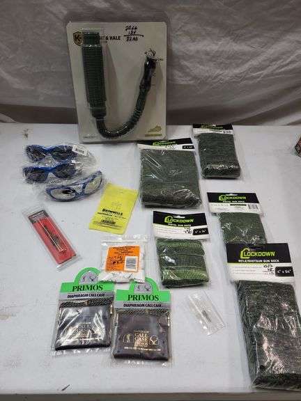 Elk calls, gun socks, sunglasses, cotton patches, cleaning brushes image