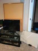 LG tv on stand w/Soundbar & roku stick bulletin boards, white board