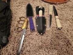 Brass knuckle knife,
Metal/ leather shield, throwing knives, pack