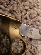 Brass knuckle knife,
Metal/ leather shield, throwing knives, pack