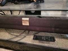 LG tv on stand w/Soundbar & roku stick bulletin boards, white board