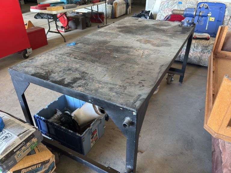 Approx 6’x3’ metal work bench on casters. 3” vice