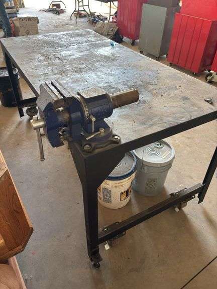 Approx 6’x3’ metal work bench on casters. 3” vice