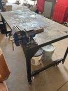 Approx 6’x3’ metal work bench on casters. 3” vice