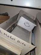 Contents on Top Side of Shelf Taps & Dies, Chisels, Drill Bits, Small Motors Etc