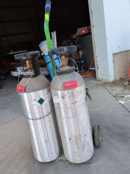 2 empty compressed nitrogen tanks non-flammable gas #2 green with rolling cart image
