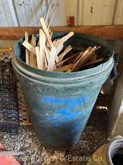 Garbage Can Full of Paint Sticks image