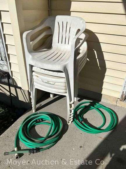 (7) White Poly Chairs and 2 Garden Hoses image