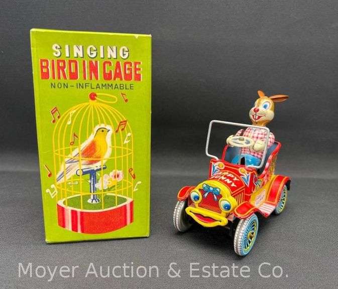 Singing Bird in Cage and Happy Bunny Tin Toy image