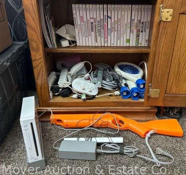 Wii Console, 5 Remotes, 2 Nunchucks, 3 Controllers, 23 Games and Accessories image