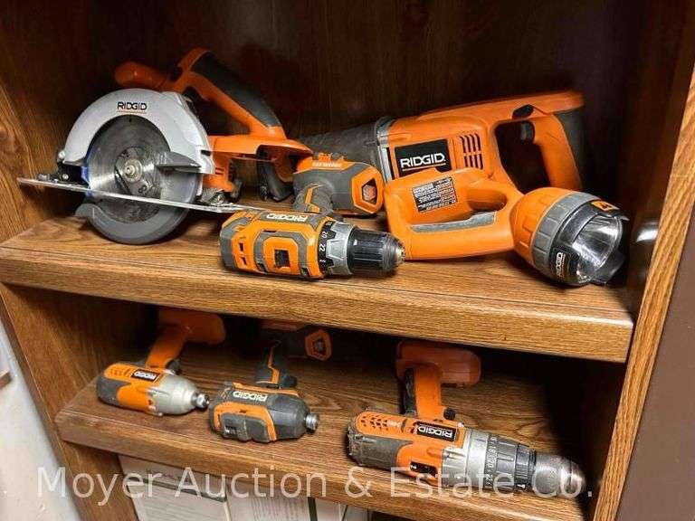 Group of Rigid Battery Powered Saws, Drills and Drivers with 2 Chargers, 4 Batteries and Carry Bag image