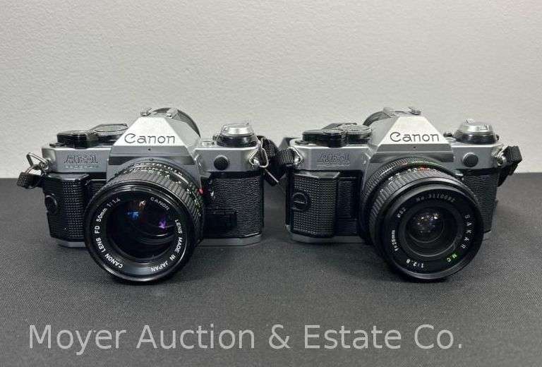(2) Canon AE-1 Program Film Cameras with Lenses image