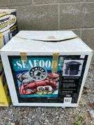 New 30qt. Aluminum Stock Pot with Lid & Used 19qt. Enamel Steam Pot with Spout and Lid