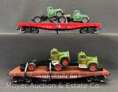 (2) Lionel Flatcars with Mack Trucks, No. 17534 and 17518, with Original Boxes