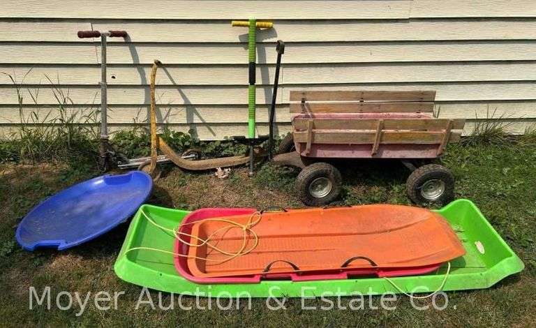 Group of Scooters, Wagon, Pogo Sticks, and Sleds image