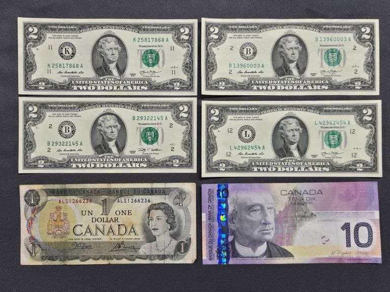 Canadian $1 Bills + Canadian $10 Bill + 4 US $2 Bills image