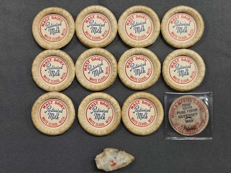 11 Milk Bottle Tops from Mast Dairy in White Cloud + 1 Bottle Top from Mast & Martens Dairy in White Cloud + 1 Arrowhead image