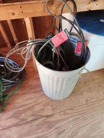Metal Garbage Can and Assorted Mower Belts image