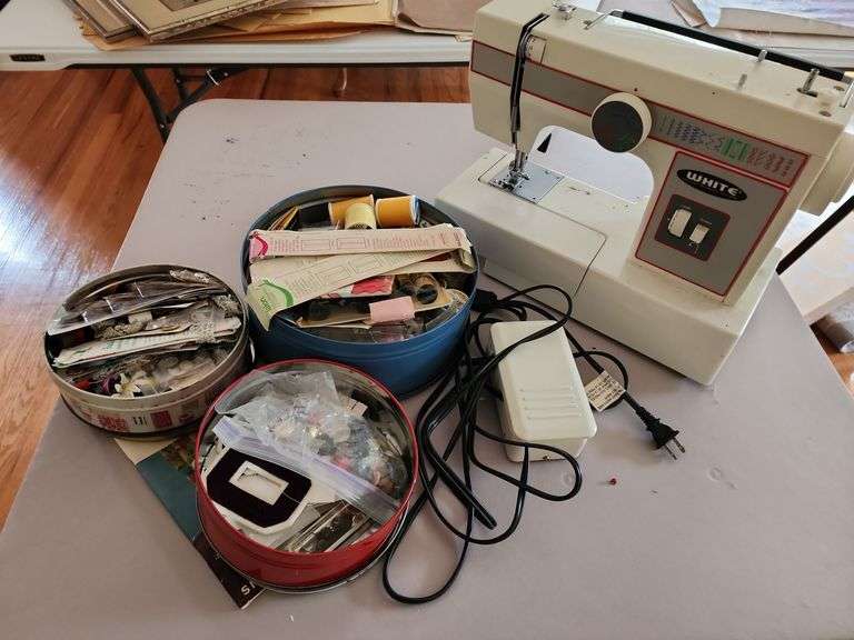 White Sewing Machine and Assorted Sewing Accessories image