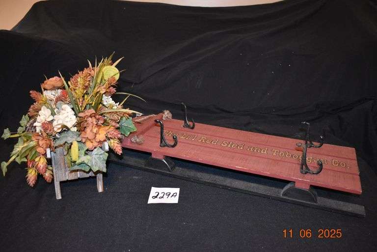 Wooden Sled and Floral Arrangement in Wooden Cart image