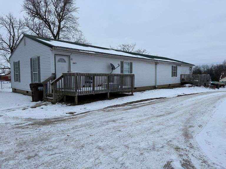 4663-4665 Jackson Road, Eminence, KY 40019.  Nice duplex with each unit having two bedrooms, two baths, large utility room, kitchen, and living room.  One unit is in good condition; the other unit will need some work.  Total they bring in $1,300 a month. image