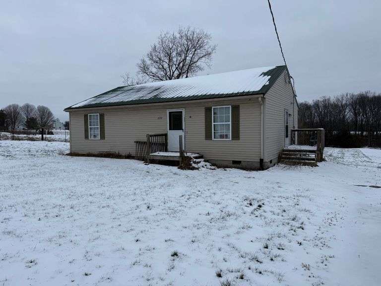 2230 Christianburg Road, Shelbyville, KY 40065 Single-family home in good condition, sitting on 1 acre.  The home has three bedrooms, 1.5 baths, 1,100 SF, living room, kitchen and utility room.  The property also has a metal building on it for a shop area or equipment storage. image