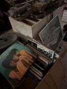 Records shelves ice skates old typewriter
