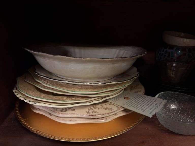 Contents of Lower Cabinet - serving bowls, plates, cups, misc