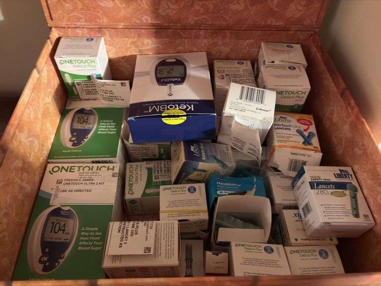 Box of Assorted Lancets and Glucose Meters