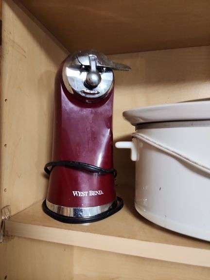 Contents of Cabinet - Toaster, Can Opener, CrockPot