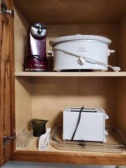 Contents of Cabinet - Toaster, Can Opener, CrockPot image