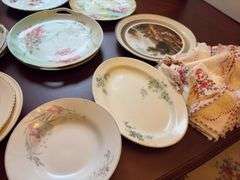 Large Group of Assorted Serving Plates & Dollies
