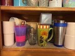 Contents of Cabinet - assorted cups and drinking glasses