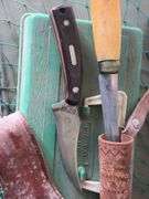 Assorted Fishing Tackel, Knives, and animal trap