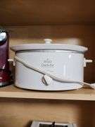 Contents of Cabinet - Toaster, Can Opener, CrockPot