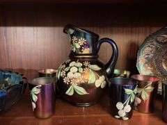 Contents of 1 Shelf - assorted cups, water pitcher, dishes