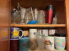 Contents of Cabinet - assorted cups and drinking glasses