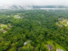 20-acre parcel located in River Bluff development off of the streets of Cherry Tree Drive and Creekview Drive.