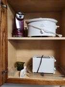 Contents of Cabinet - Toaster, Can Opener, CrockPot