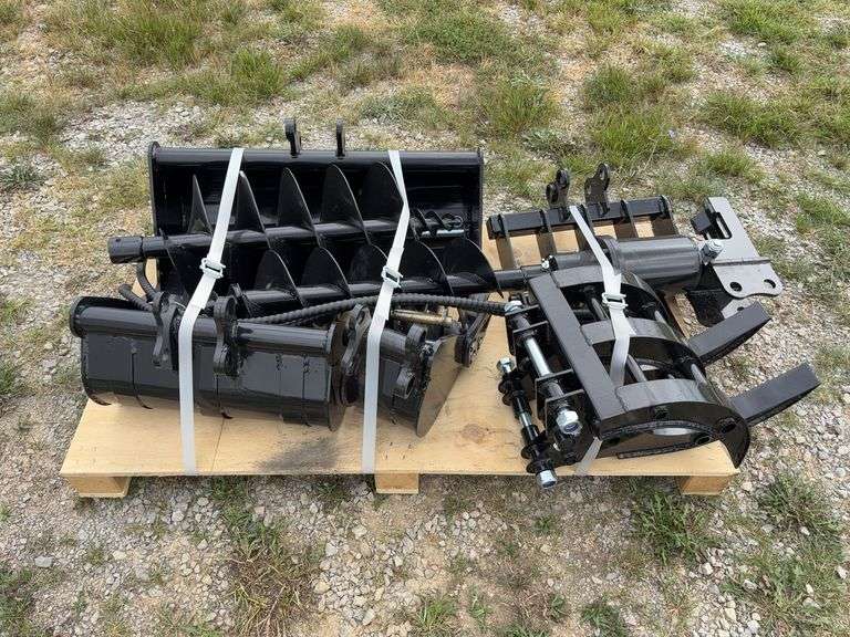 Pallet of (9) Mini Excavator Attachments - (1) 8” Bucket, (1) 20” Bucket, (1) 32” Bucket, (1) Quick Coupler, (1) Ripper, (1) Grapple, (1) Rake, (1) 8” Auger, (1) 12” Auger image