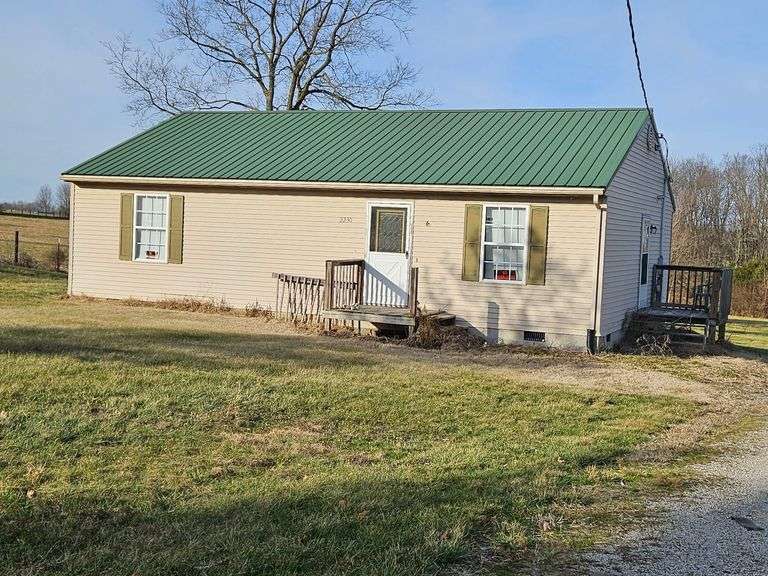 2230 Christianburg Road, Shelbyville, KY 40065 Single-family home in good condition, sitting on 1 acre.  The home has three bedrooms, 1.5 baths, 1,100 SF, living room, kitchen and utility room.  The property also has a metal building on it for a shop area or equipment storage. image