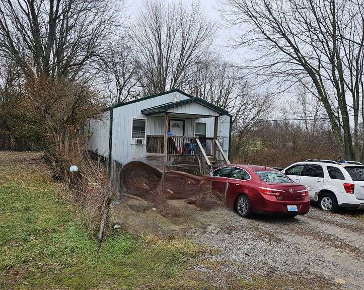 248 Merriweather Avenue, Eminence, KY 40019   Single family home with three bedrooms, two baths, in need of some repair.  Good location and good renters in place that pay $600 per month and tenant pays all utilities. image