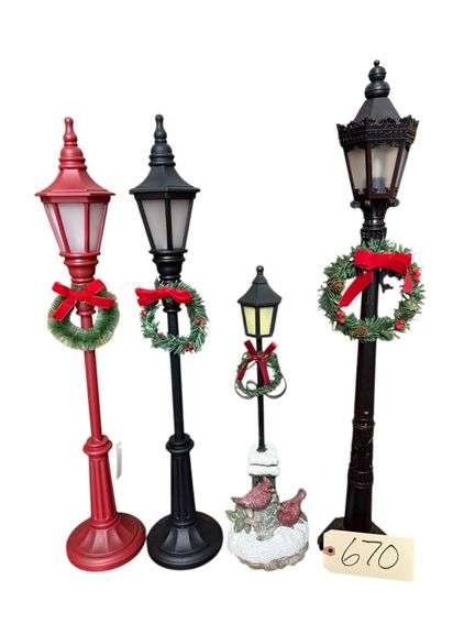 3 BLACK AND 1 RED CHRISTMAS LAMP POSTS image