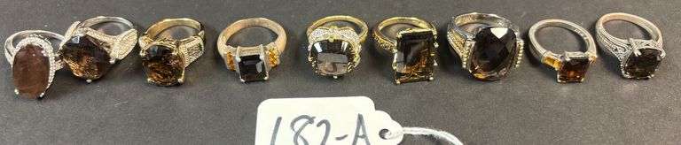 9 STERLING SILVER RINGS, MOST W/ SMOKY QUARTZ STONES, NICE CUTS - 65.36 GRAMS, 2.10 TROY OZ - SIZES RANGE FROM 6-8 image