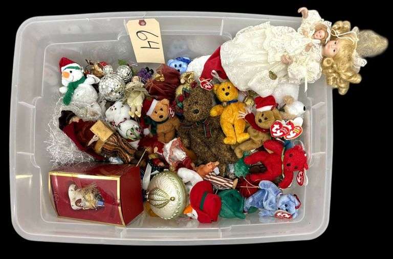 CLEAR TOTE WITH GREEN LID FULL OF CHRISTMAS DECOR INCLUDING TY BEANIES, DOLL ORNAMENTS, VICTORIAN LACE DOLL (TOPPER?), LENOX ORNAMENT, ETC. image