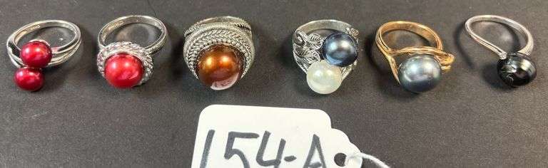 6 STERLING RINGS W/ CULTURED PEARL STONES, VARYING COLORS - 1.17 TROY OZ, 36.40 GRAMS INCLUDING STONES - SIZES RANGE 6-7 image