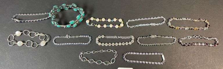 12 STERLING 925 BRACELETS W/ VARIOUS STONES INCLUDING RUBY RED, JADE, SAPPHIRE, EMERALD, MULTICOLOR, ETC. image